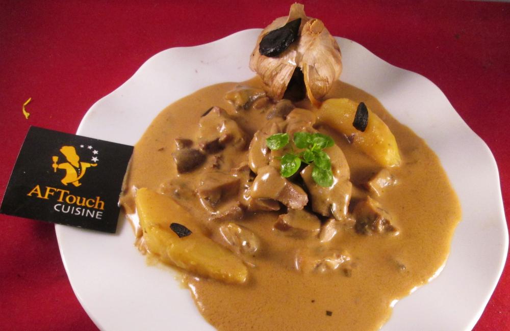 Rognons de veau sauts en creme d'ail noir